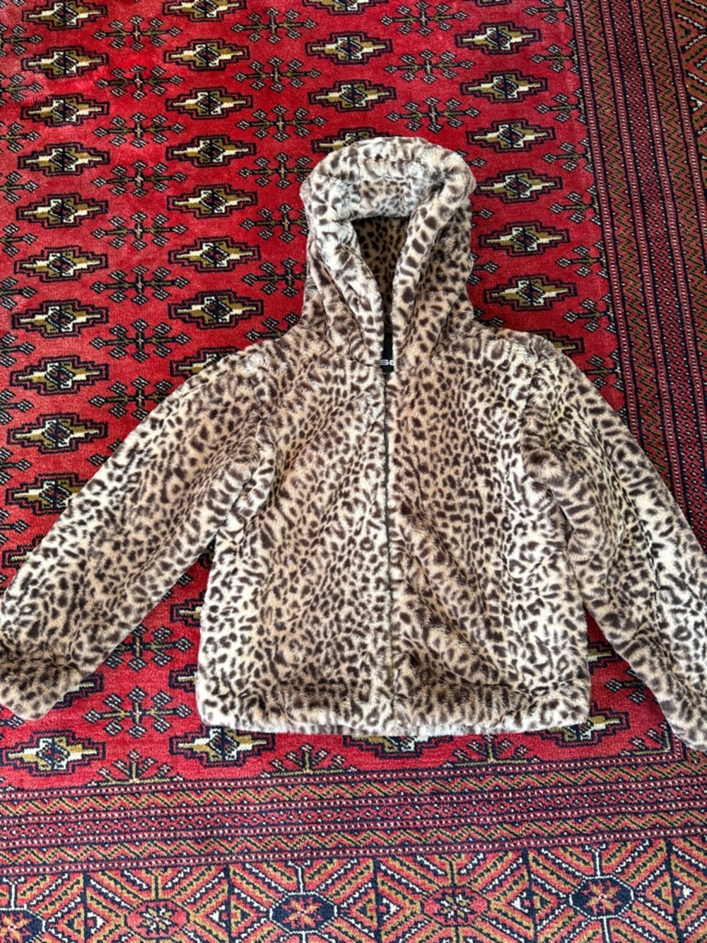 Faux leopard fur zip up hoodie.
